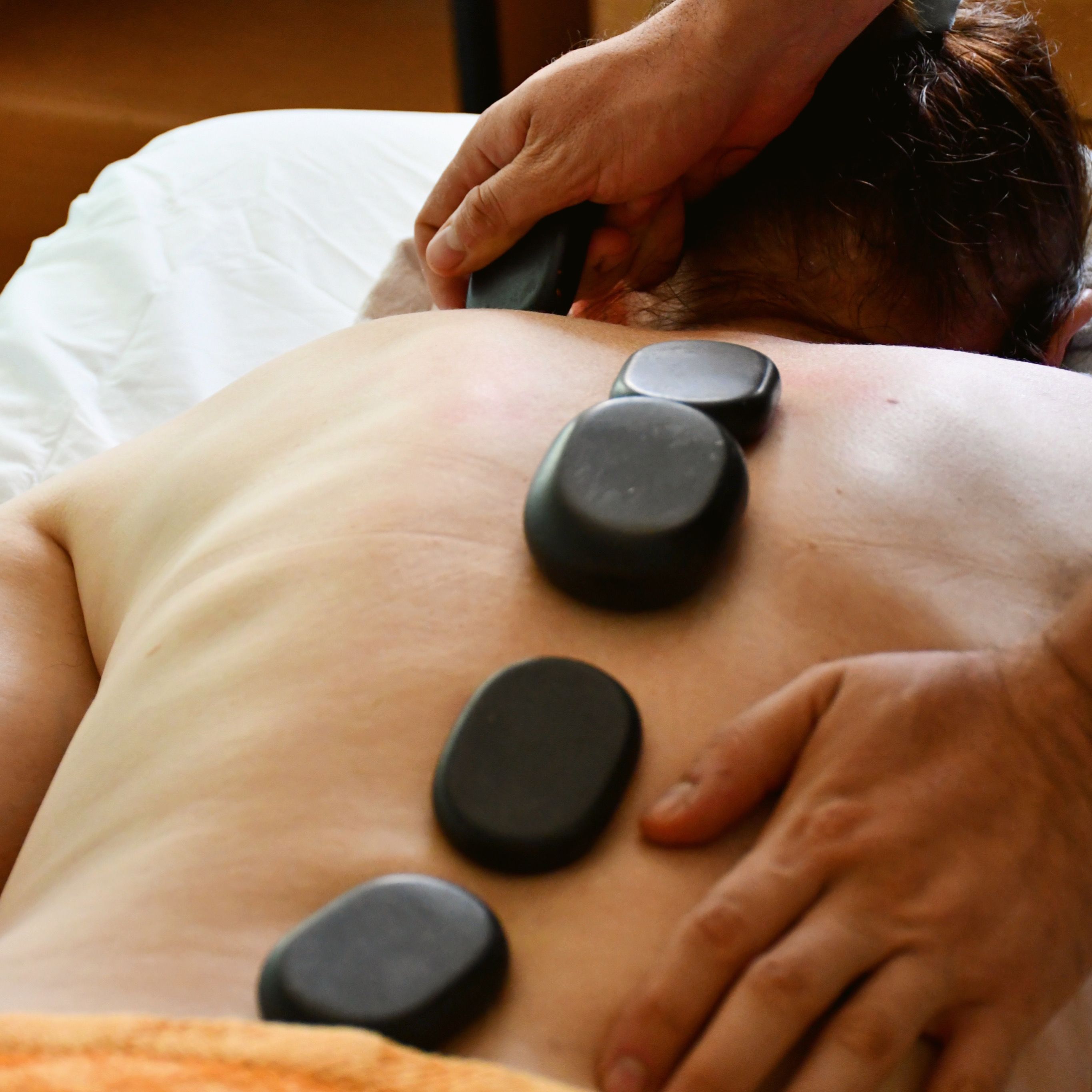 Relaxing hot stone massage treatment